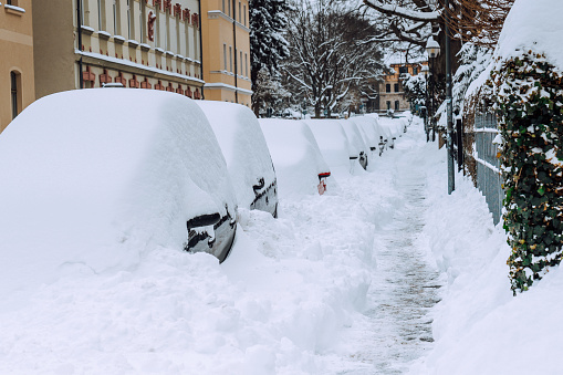 Cars under the snow,  winter city street