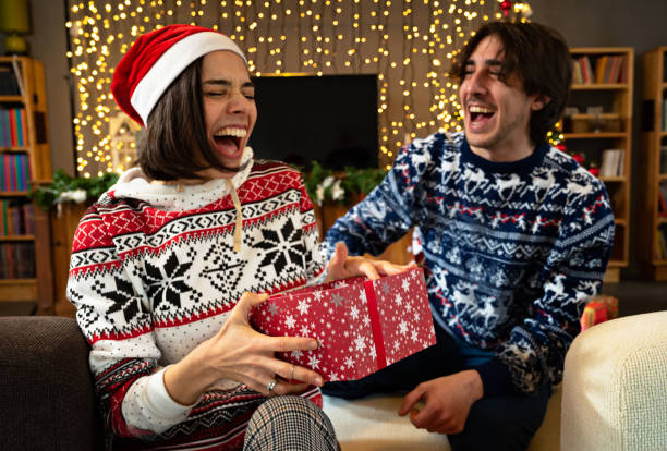 istock Man giving a Christmas Present 1352707496