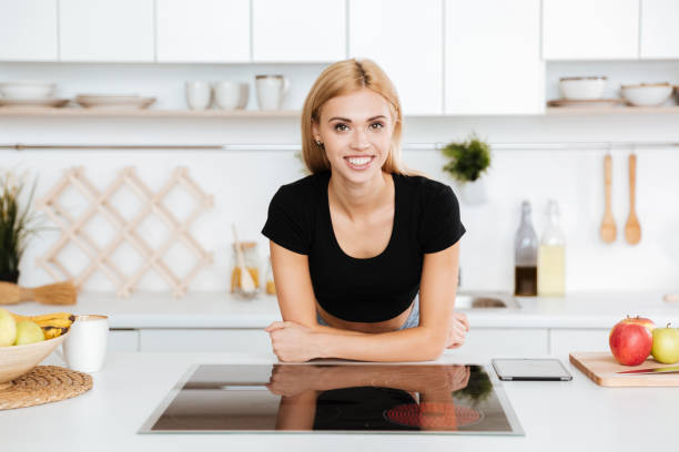 istock Smiling woman with crossed arms 1352707654