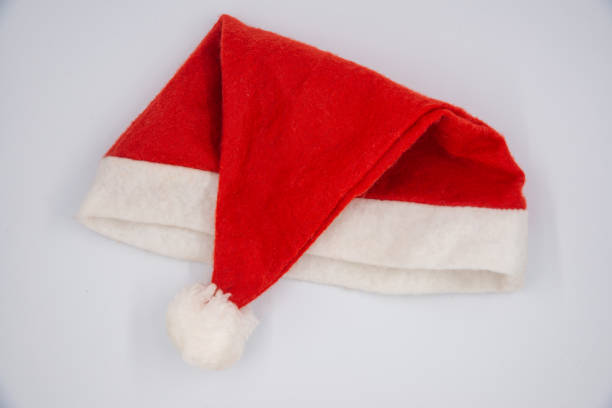 istock Santa Claus red hat isolated on white background 1352713342