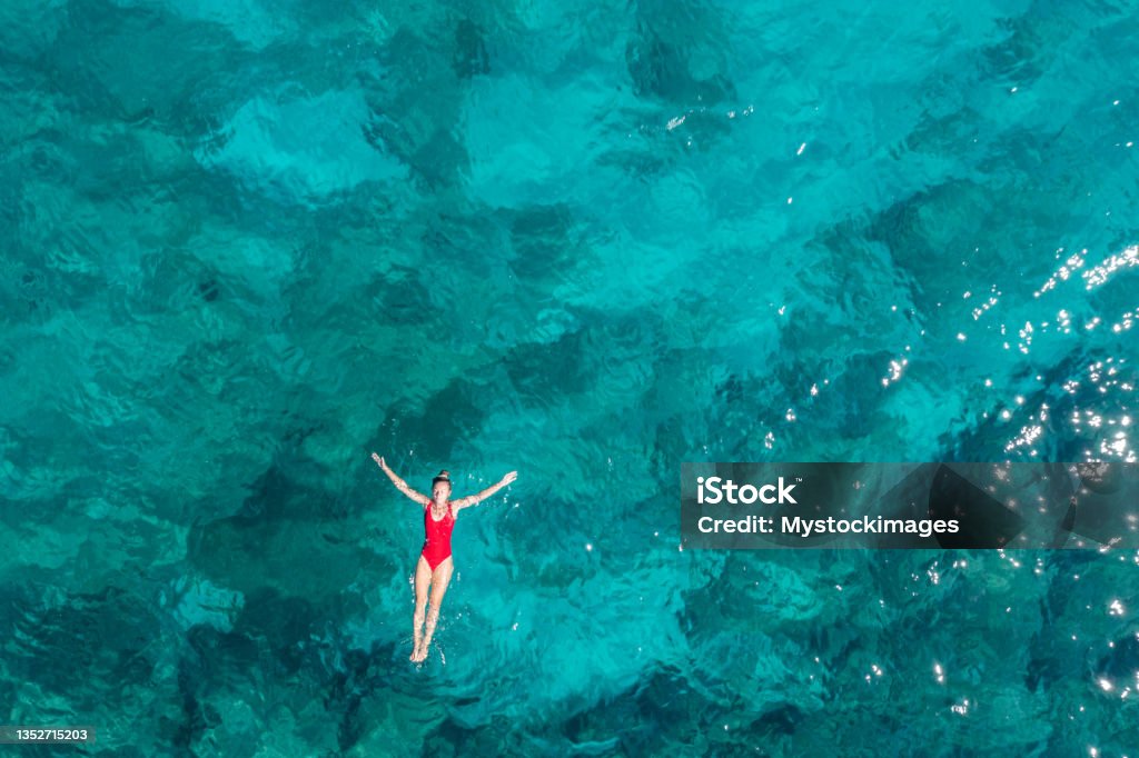 Woman floating turquoise sea She wears a red swimsuit that contrastes the blue of the sea.
Croatia Sea Stock Photo