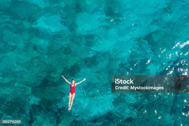Woman Floating Turquoise Sea Stock Photo - Download Image Now - Sea, Beach, Summer