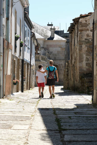 istock Mother and son sightseeing in a small Spanish village 1352715254
