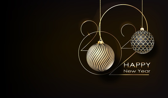 Happy new year 2022. White paper numbers with golden Christmas decoration and confetti on dark background. Holiday greeting card design.