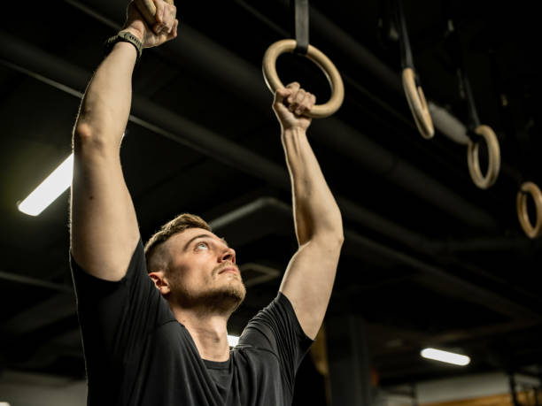 istock Man exercising in the Gym 1352721901