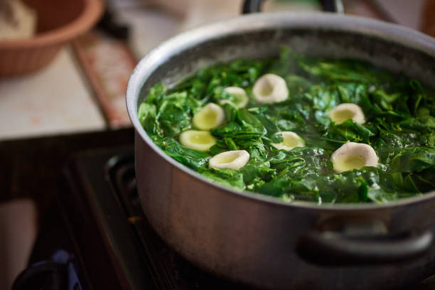 istock Green tomatoes in saucepan filled with boiling water 1352723992