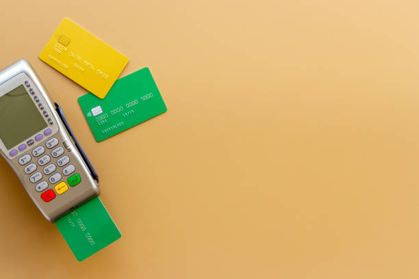 istock Payment transactions with credit card by pos terminal. Top view 1352725650