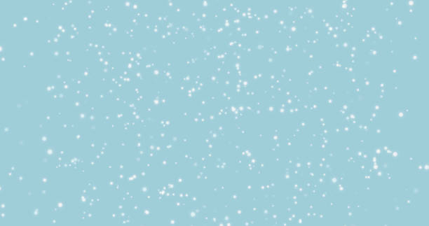 istock blue background with white bokeh lights of shining shiny blurry round particles with soft focus. 1352726752
