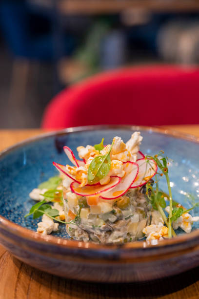 istock delicious salad Olivie with vegetable popcorn 1352728109