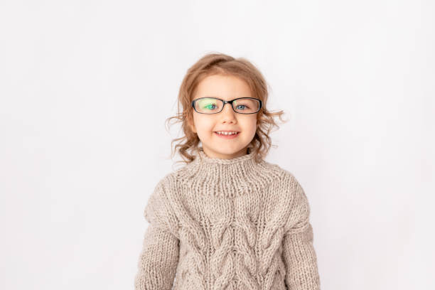 istock small child girl with glasses on white background, space for text 1352728419