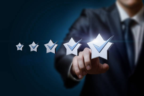 istock Businessman clik on a five star rating on a blue background. 1352730035