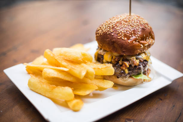 istock Hamburger on a plate, with french fries 1352730901