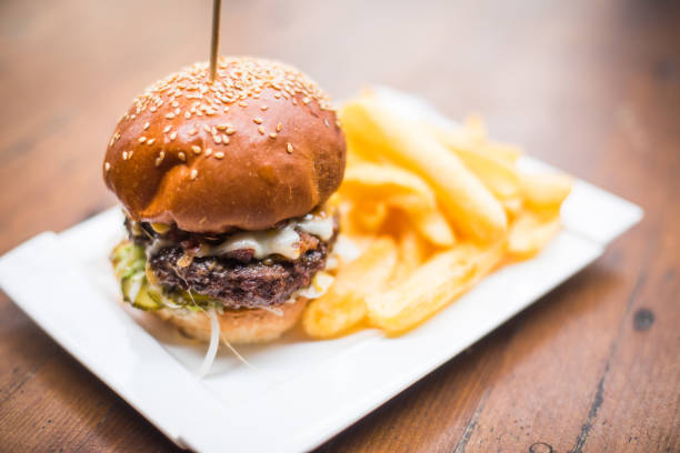 istock Hamburger on a plate, with french fries 1352730951