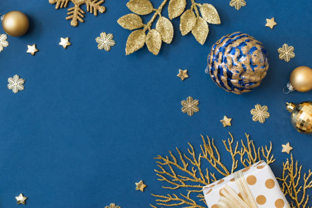 istock Christmas holiday composition. Flat lay frame with christmas balls and gift box on a blue background 1352732686