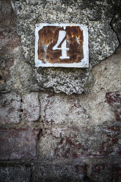 istock Number 4 plaque on a house wall 1352732979