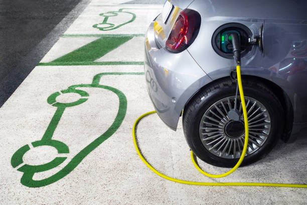 istock Electric car charging at charging station 1352734207