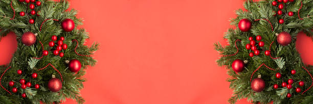 istock Christmas banner. Christmas ring or wreath on the red background. Copy space. 1352734247