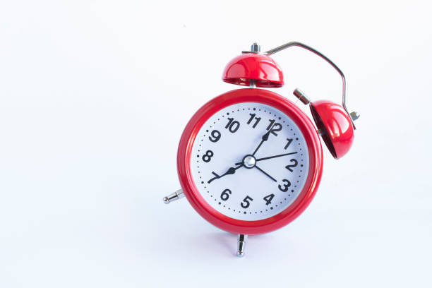 istock Red alarm clock on the white background. Close-up. Copy space. 1352734249