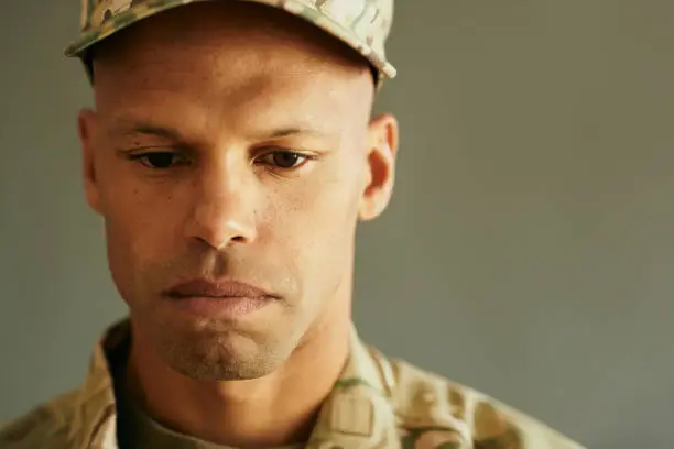 Close-up of thoughtful African American military man. Copy space.