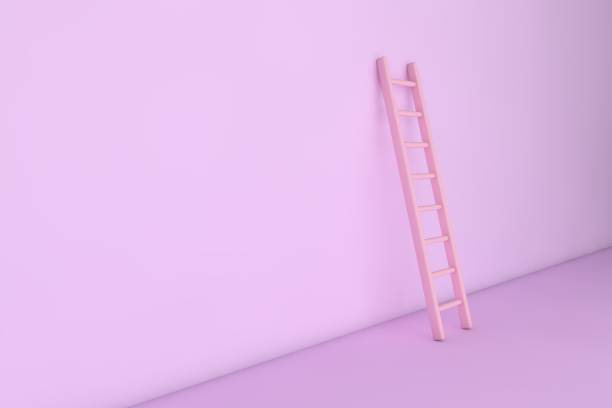 istock Pink step ladder near the wall 1352735110