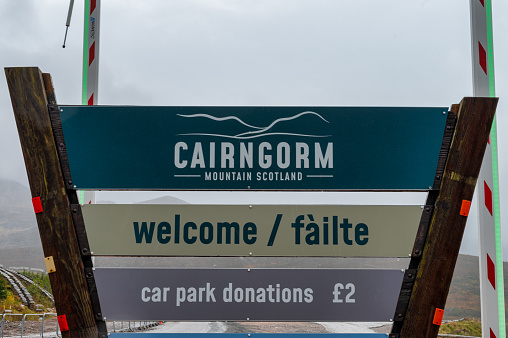 Cairngorm, Scotland- Oct 18, 2021:  The main sign for Cairngorm Mountain Scotland at the entrance to the car park of the ski lodge
