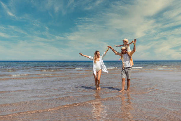 Shot of a happy family spending time at the beach