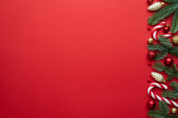 istock Red Christmas background with fir branches and decorations 1352738050