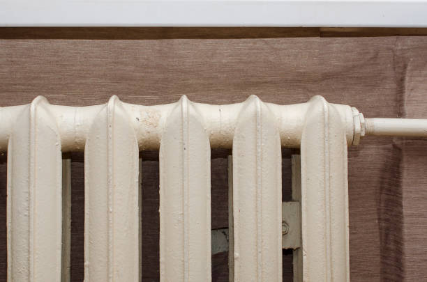 istock Cast iron battery in an apartment, Russia. 1352738535