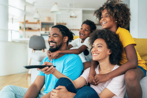 istock Family watching television 1352738650