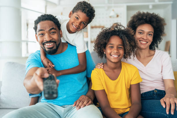istock Family watching television 1352738653