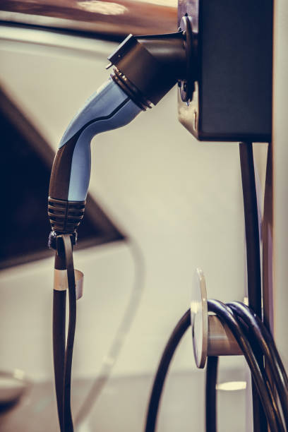 istock Charging plug for an electric car 1352740495