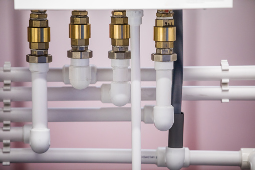 Image of various PVC pipes and fittings.