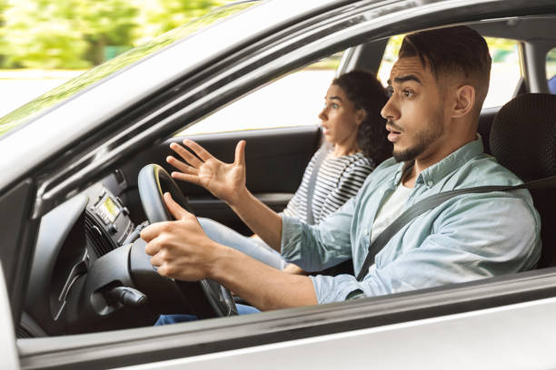 istock Shocked middle-eastern young couple having car accident 1352741238