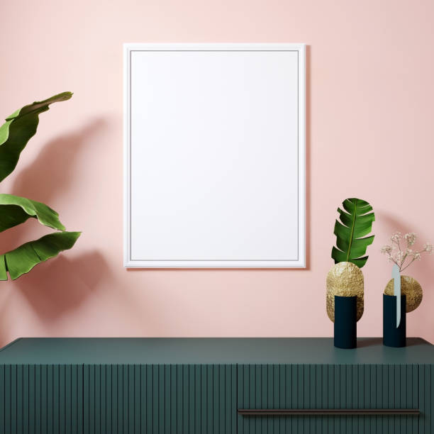 istock Mock up poster frame in  modern interior with white frame and plants in vase. Pink wall background. Scandinavian style. 3d rendering 1352743122