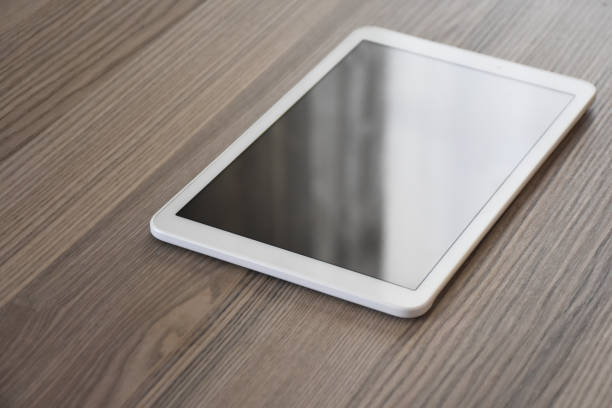 istock Digital tablet on the wooden desk 1352745996