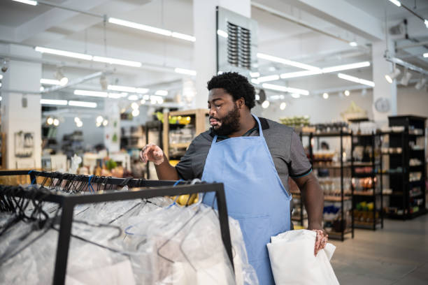 istock Salesman organizing products at a decoration store 1352746551
