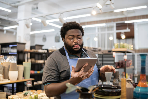istock Salesman checking out products at a decoration store 1352746580