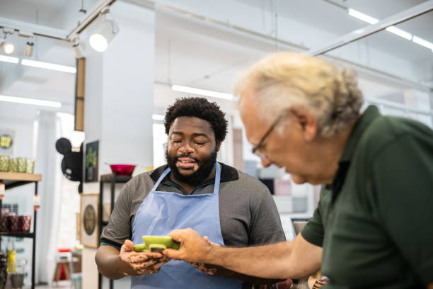 istock Salesman helping a senior man at a decoration store 1352747122