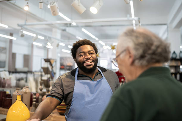 istock Salesman helping a senior man at a decoration store 1352747139