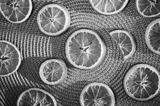 Dried oranges, black and white image.