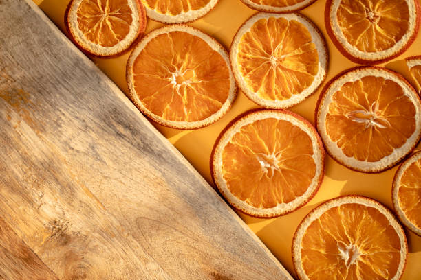 Dried oranges on a yellow background. Photo