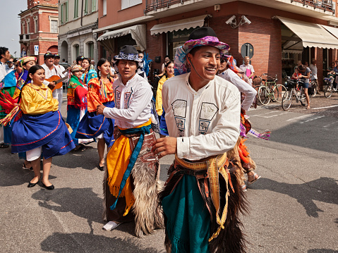 the folk dance ensemble Cuniburo Cultural from Ecuador performs traditional dance in the town street during the International Folklore Festival in Russi, Ravenna, Italy - August 2, 2018