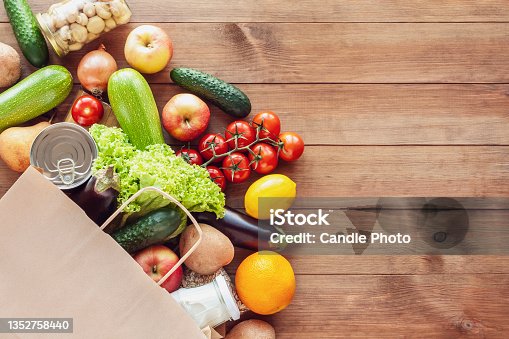 istock Paper shopping food bag with grocery and vegetables 1352758440