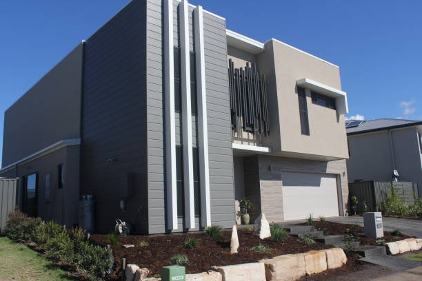 A new 2 storey residential building with new landscaping, retaining wall from the street