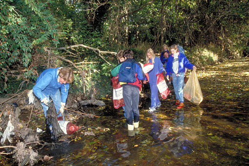 School children and adults participate in a river and stream clean-up day in the Missouri Ozarks.