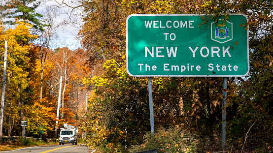New Canaan, CT, USA -  November 11, 20121: Welcome to New York The Empire state sign on Connecticut and New York border line