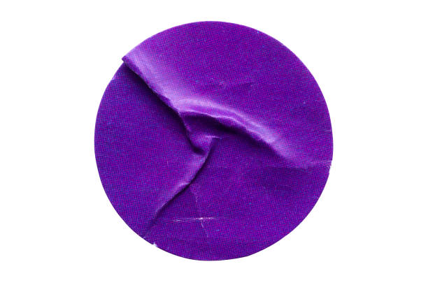 istock Blank purple round adhesive paper sticker label isolated on white background 1352766337