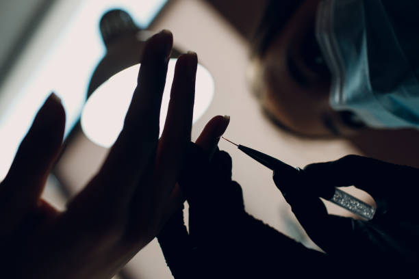 istock Manicure process female hands finger nails polish 1352767749