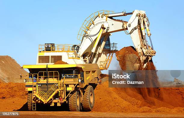 Excavator Loading Ore Into A Haul Truck Stock Photo - Download Image Now - Mining - Natural Resources, Truck, Blue