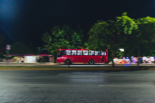 Cancun, Mexico - Motion of City Bus travelling through Streets at night